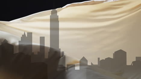 Animation-of-silhouette-of-cityscape-and-floating-cloth-on-black-background