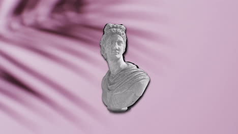 Animation-of-ancient-sculpture-bust-with-glitch-over-shadow-of-palm-leaf-on-pink-background