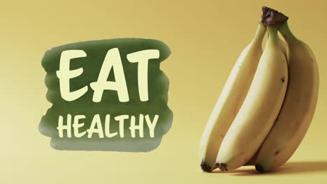 Animation-Von-„Eat-Healthy“-Text-über-Bananen-Auf-Gelbem-Hintergrund