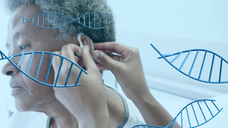 Animation-of-dna-strands-over-diverse-female-doctor-and-patient-in-hospital