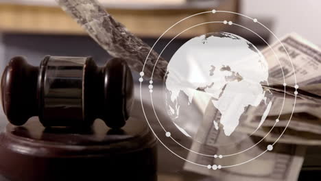 Animation-of-spinning-globe-over-banknotes-and-gavel