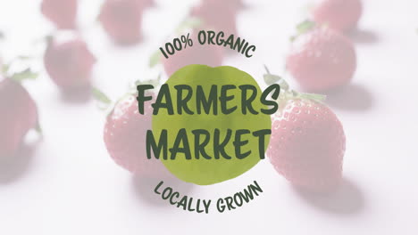 Animation-of-farmers-market-text-over-strawberries-on-pink-background