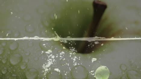 Composition-of-green-apple-over-water-bubbles