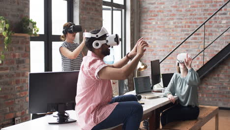Three-people-are-engaged-in-virtual-reality-experiences-in-a-modern-business-office