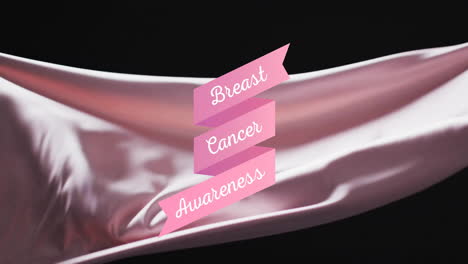 Animation-of-breast-cancer-awareness-text-on-pink-over-blowing-grey-fabric