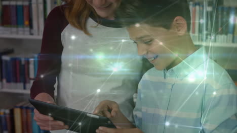 Animation-of-network-of-connections-over-diverse-female-teacher-and-schoolboy-using-tablet