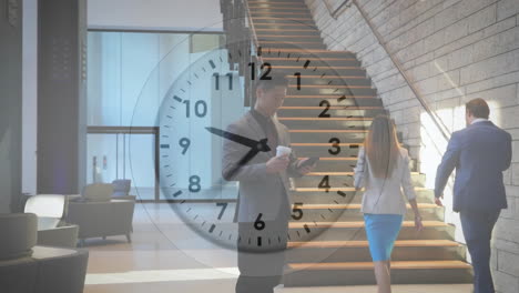 Animation-of-clock-with-fast-moving-hands-over-caucasian-businessman-in-foyer-using-smartphone