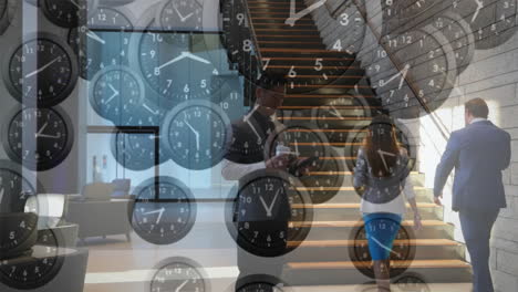 Animation-of-falling-clocks-with-fast-hands-over-caucasian-businessman-using-smartphone-in-foyer