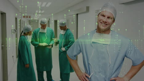 Animation-of-data-processing-over-caucasian-male-surgeon-smiling-in-hospital-corridor