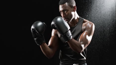 Montage-video-of-african-american-male-boxes-in-boxing-gloves-or-black-background