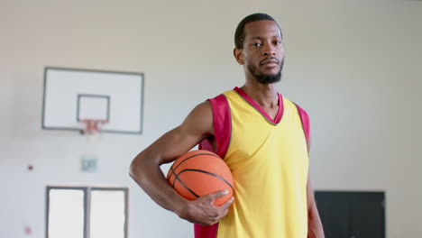 African-American-man-poses-confidently-in-a-gym