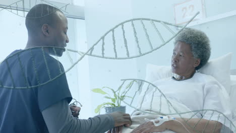Animation-of-dna-strands-over-african-american-male-doctor-and-senior-female-patient-in-hospital-bed