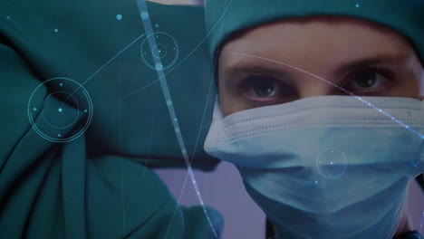 Animation-of-network-of-connections-with-shapes-over-caucasian-female-surgeon-during-surgery