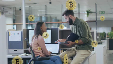 Animation-of-bitcoins-over-diverse-male-and-female-colleague-talking-at-casual-office