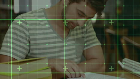 Animation-of-green-squares-and-shapes-over-caucasian-male-student-reading