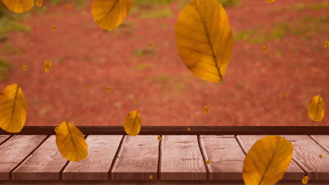 Animation-of-autumn-leaves-falling-over-wooden-surface