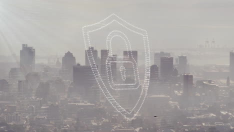 Animation-of-padlock-and-shield-icon-over-modern-cityscape
