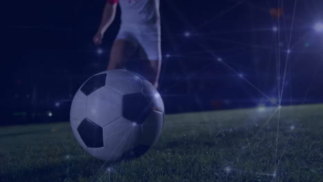 Animation-of-network-of-connections-over-caucasian-male-football-player-kicking-ball-on-field