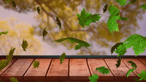 Animation-of-autumn-leaves-falling-over-trees-and-wooden-surface