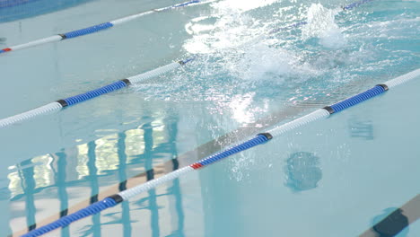 Swimmer-in-action-at-a-pool,-with-copy-space