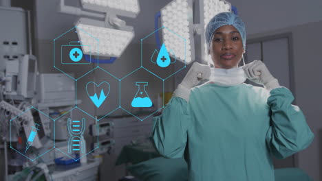 Animation-of-network-medical-icons-over-african-american-female-surgeon-smiling-in-theatre