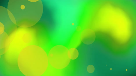 Animation-of-orange-glowing-spots-over-vibrant-abstract-green-and-yellow-background