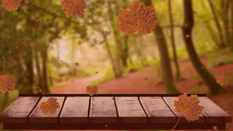 Animation-of-autumn-leaves-falling-over-trees-and-wooden-surface