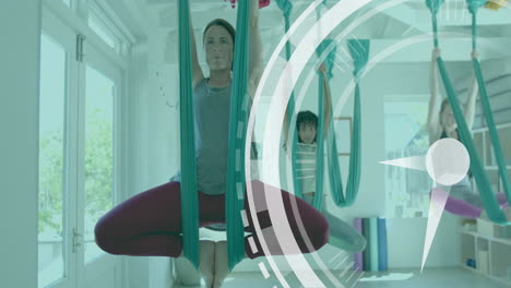 Animation-of-scanner-processing-over-diverse-female-instructor-and-teenage-girls-doing-aerial-yoga