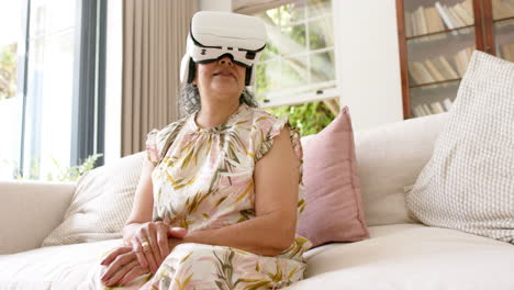Senior-biracial-woman-explores-virtual-reality-at-home
