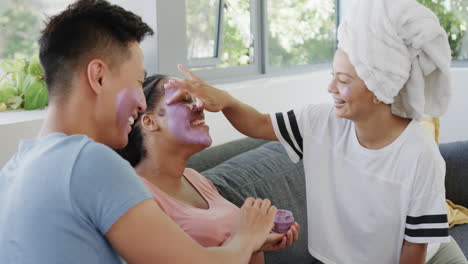 Young-Asian-man-and-biracial-women-enjoy-a-spa-day-at-home