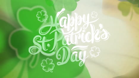 Animation-of-shamrocks-and-happy-st-patrick's-day-text-over-flag-of-ireland