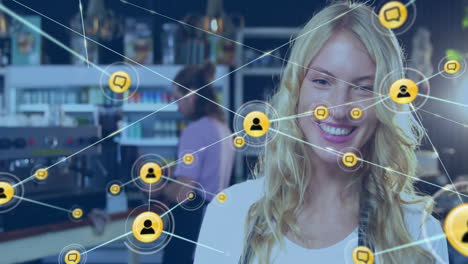 Animation-of-network-of-connections-with-people-icons-over-caucasian-woman-with-tablet-in-cafe