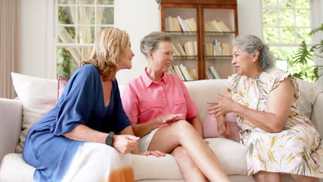 Senior-diverse-group-of-women-share-a-conversation-at-home