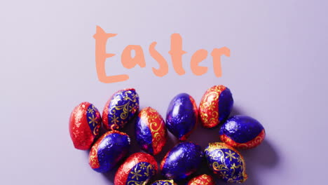 Animation-of-easter-text-over-colourful-easter-eggs-on-purple-background
