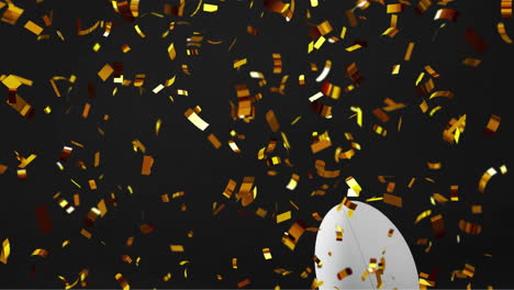 Animation-of-confetti-over-white-rugby-ball-on-black-background