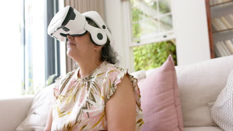 Senior-Caucasian-woman-experiences-virtual-reality-at-home