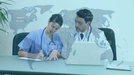 Animation-of-data-processing-with-world-map-over-diverse-doctors-using-laptop