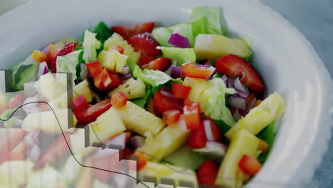 Animation-of-data-processing-and-diagrams-over-fresh-fruit-salad