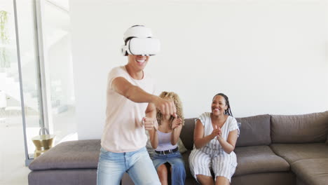 Young-Asian-man-enjoys-virtual-reality-at-home,-with-copy-space