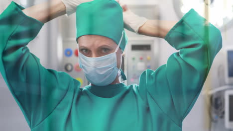Animation-of-data-processing-over-caucasian-female-surgeon-in-face-mask-in-hospital