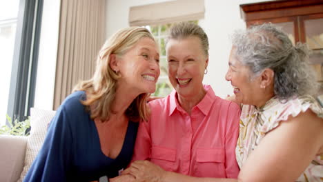 Caucasian-and-senior-biracial-women-share-a-joyful-moment-at-home