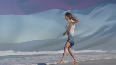 Animation-of-flag-of-netherlands-over-caucasian-woman-at-beach