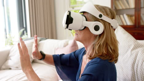 Senior-Caucasian-woman-explores-virtual-reality-at-home