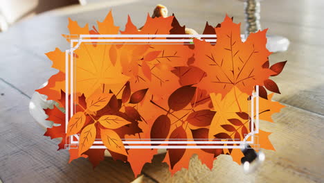 Animation-of-frame-with-fall-leaves-over-dish-with-chicken