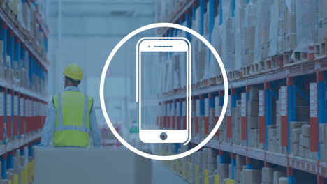 Animation-of-smartphone-icon-in-circle-over-caucasian-man-working-in-warehouse