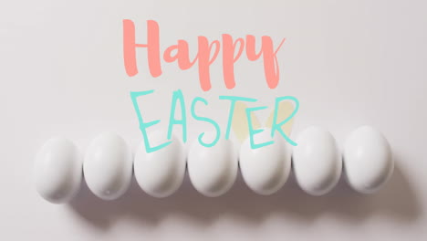 Animation-of-happy-easter-text-over-white-easter-eggs-on-white-background