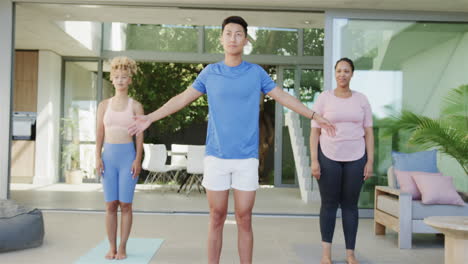 Young-Asian-man-leads-a-yoga-session-at-home