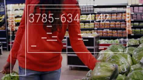 Animation-of-data-processing-and-diagrams-over-caucasian-woman-picking-vegetables-in-shop