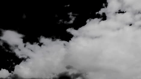 Animation-Von-Wolken,-Die-Sich-über-Einen-Schwarzen-Hintergrund-Bewegen