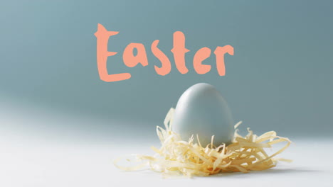 Animation-of-easter-text-over-blue-easter-egg-in-hey-on-blue-background